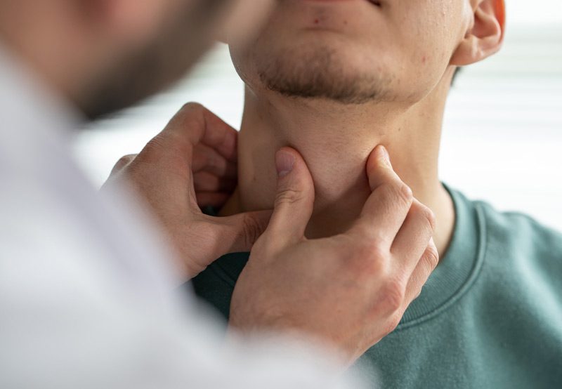 Doctor-checking-patient's-neck-mass