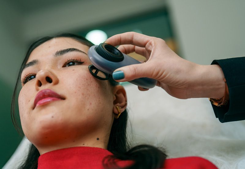 Doctor-examining-patient's-face