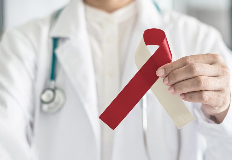 Doctor-holding-oral-cancer-awareness-ribbon
