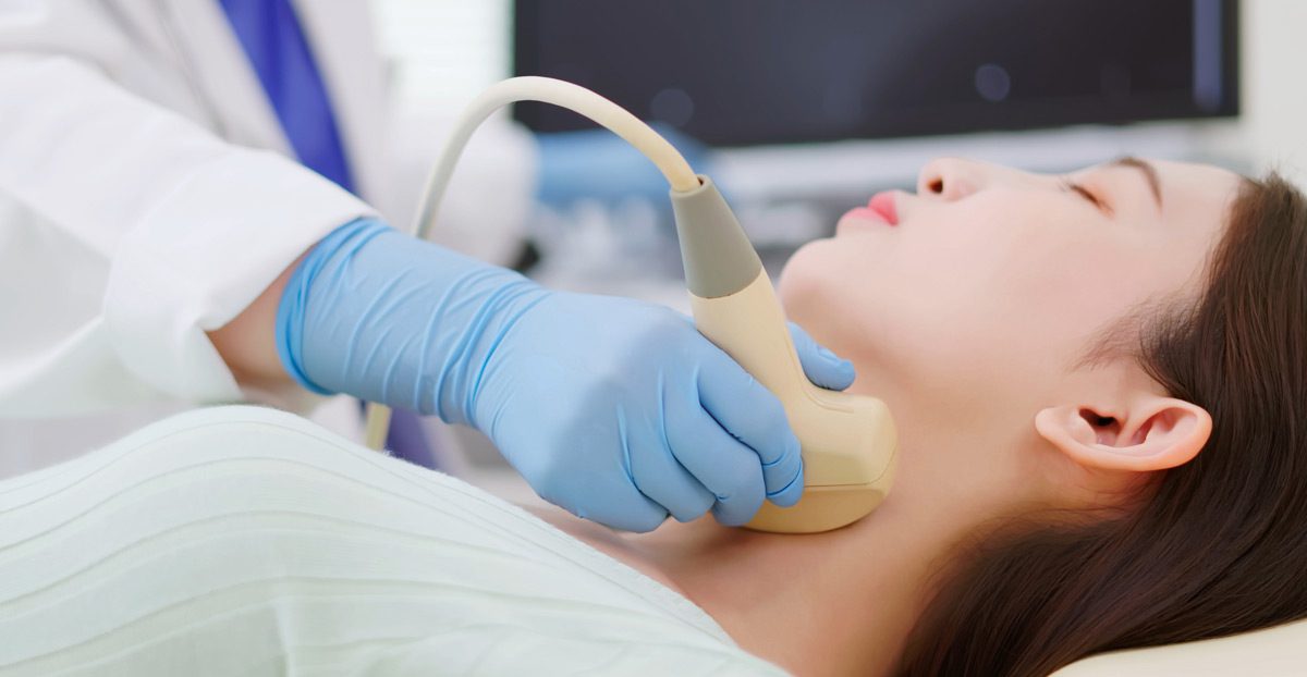 Performing-neck-ultrasound-to-check-thyroid-gland