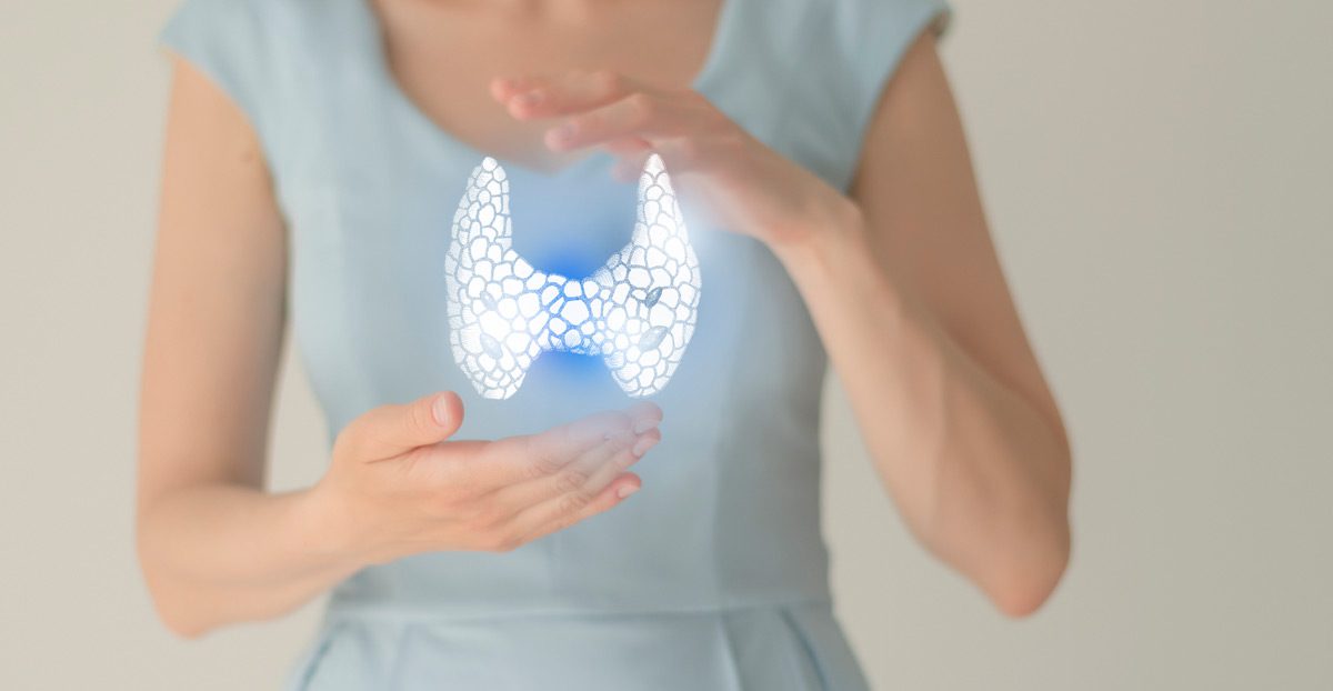 Woman-holding-a-virtual-hand-drawn-thyroid-gland