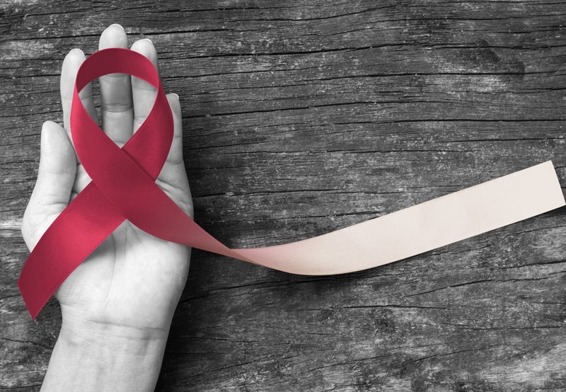 hand-holding-head-and-neck-cancer-awareness-ribbon