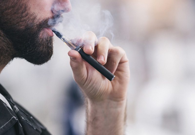 young-man-smoking-electronic-cigarette